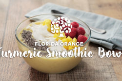 florida orange juice smoothie bowl topped with mango, berries, coconut and chia seeds