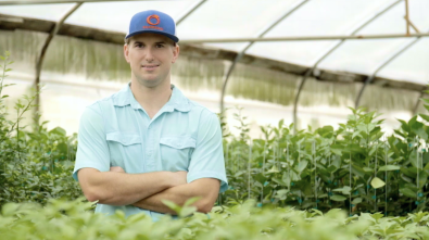 Aaron Nimrod in a greenhouse