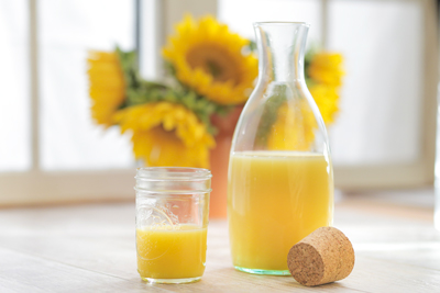 Orange juice in carafe with glass image