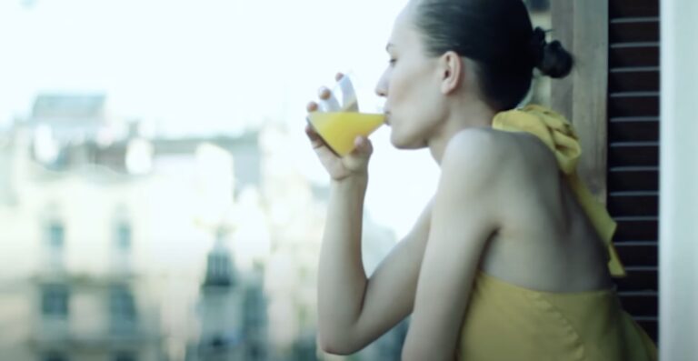 Woman drinking Florida Orange Juice image