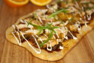 Flatbread topped with BBQ chicken, olive oil and cilantro