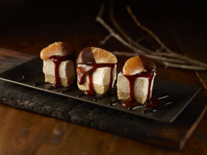 S'mores drizzled with melted chocolate.