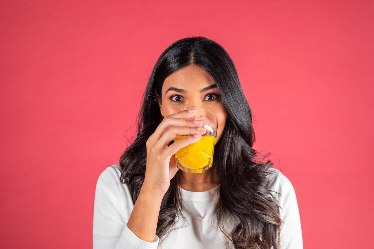 Woman drinking orange juice