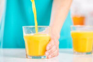 Orange Juice being poured into glass