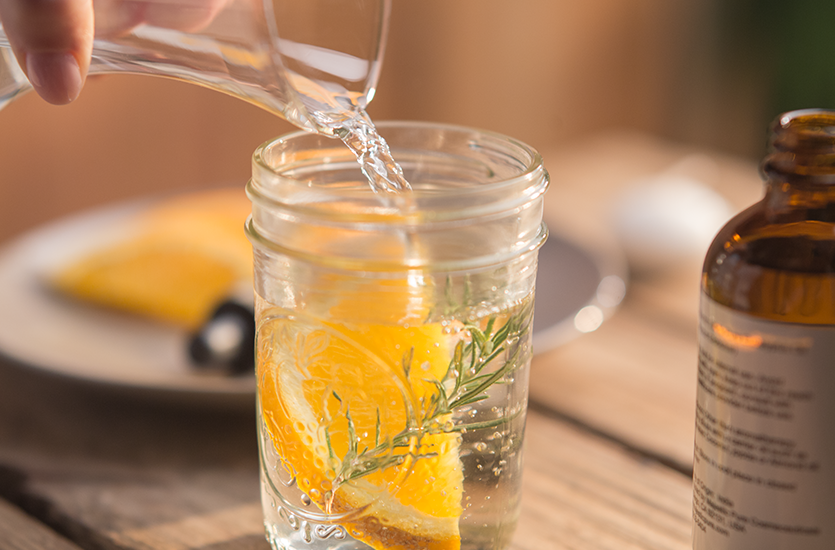 Orange Rosemary Citronella Candle 2 pouring water in glass 2