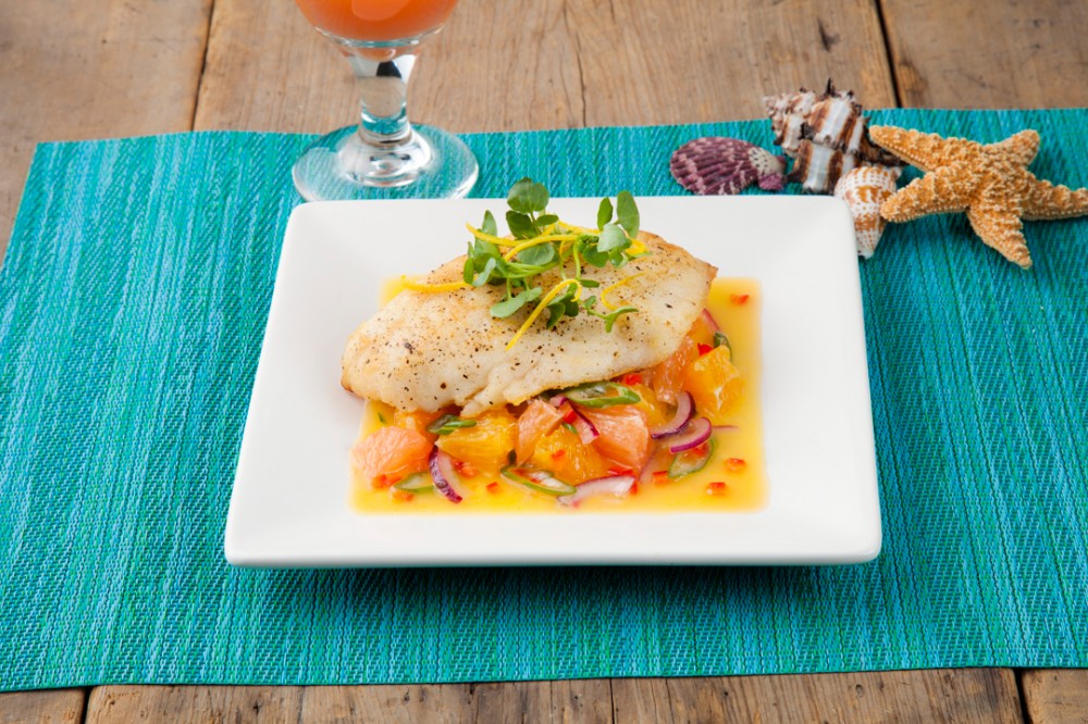 Pan seared grouper with Florida Citrus salad on a plate