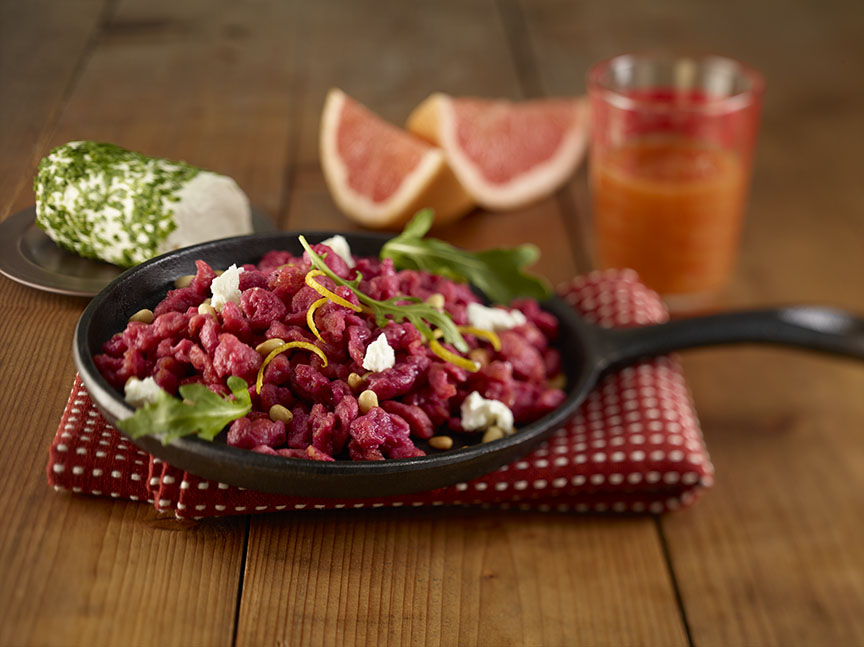 Citrus And Beet Spaetzle with Pine Nuts, Goat Cheese and Baby Arugula