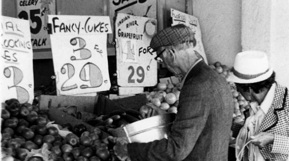 old black and white photo of selling of oranges